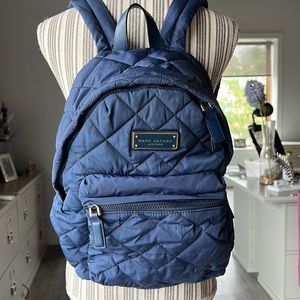 Marc Jacobs blue quilted backpack.